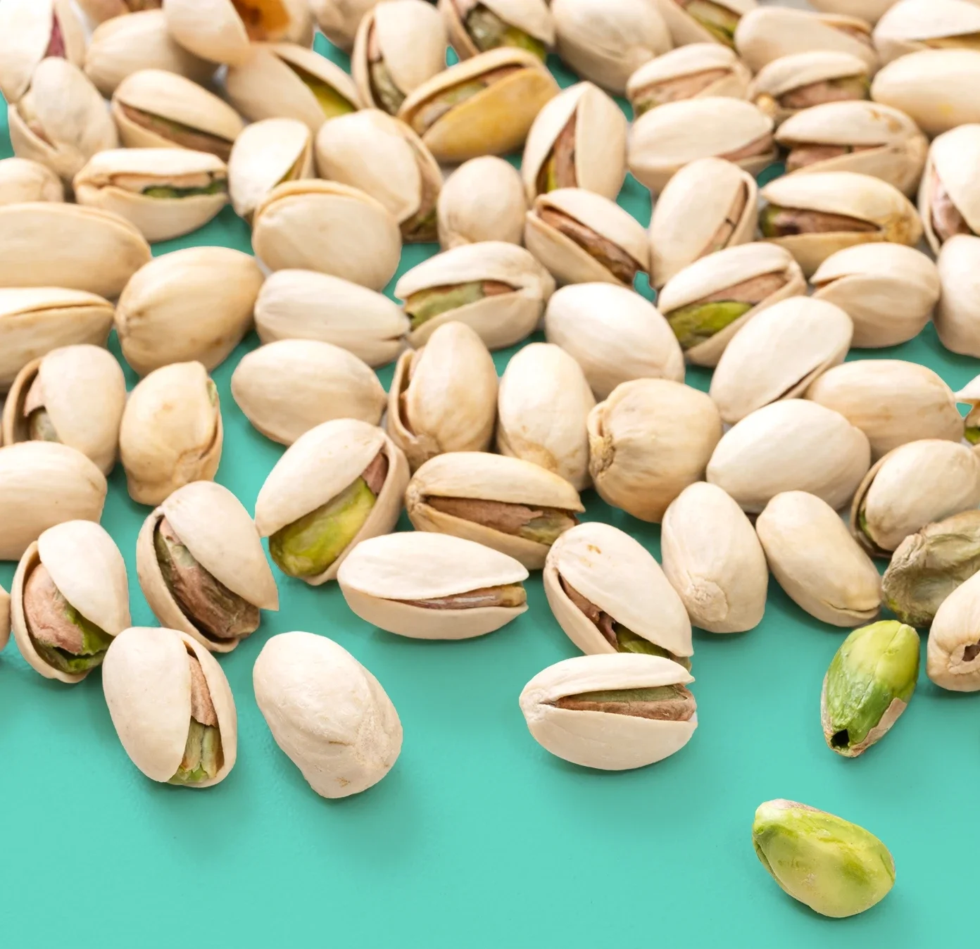 pistachios_on_teal_background_2260164979